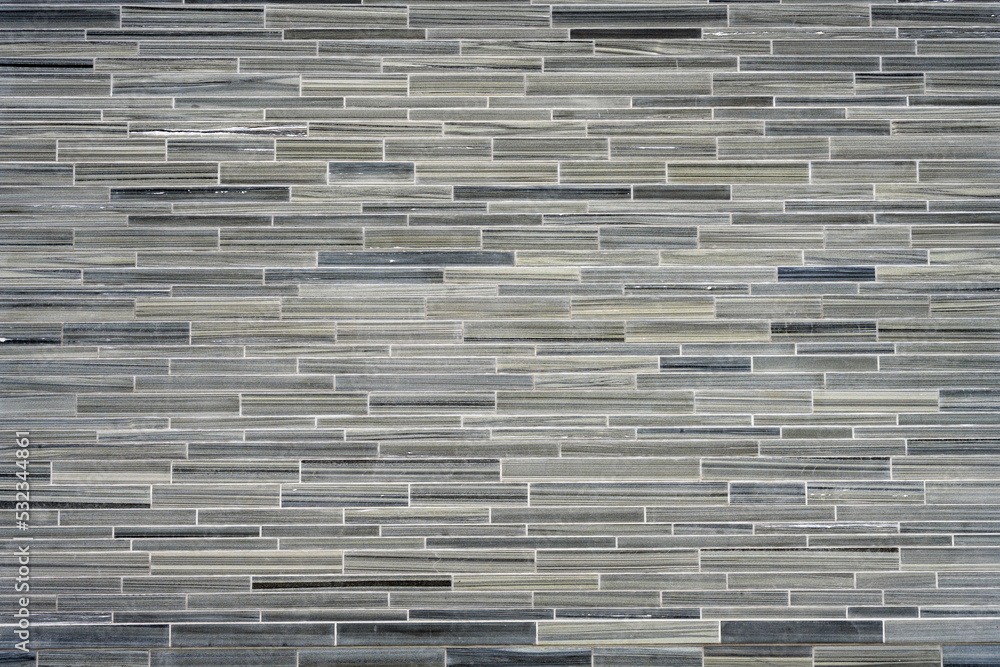Background from a wall made of small gray granite tiles Background from a wall made of small gray granite tiles