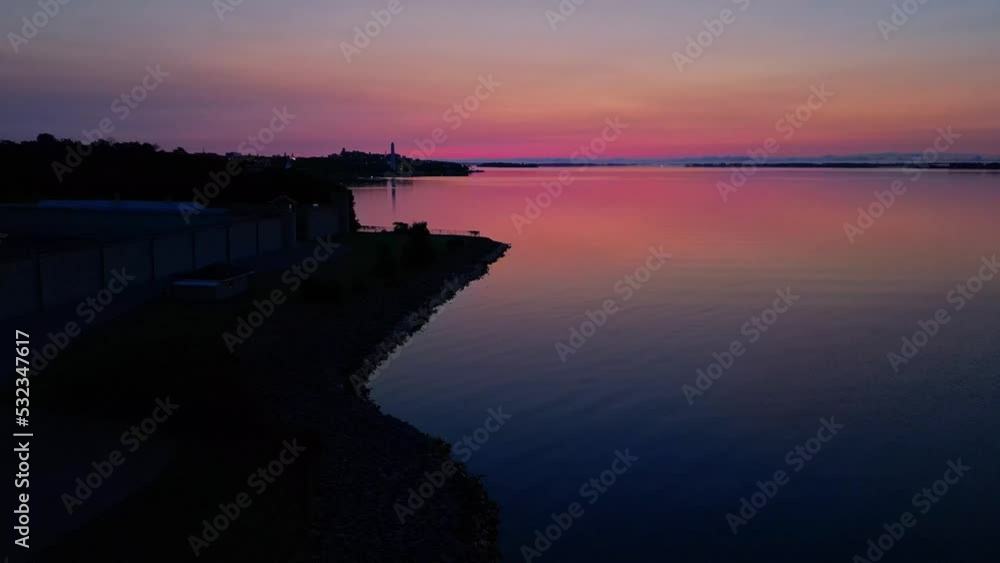 Aerial of red glow Sunrise over a calm lake Aerial of red glow Sunrise over a calm lake