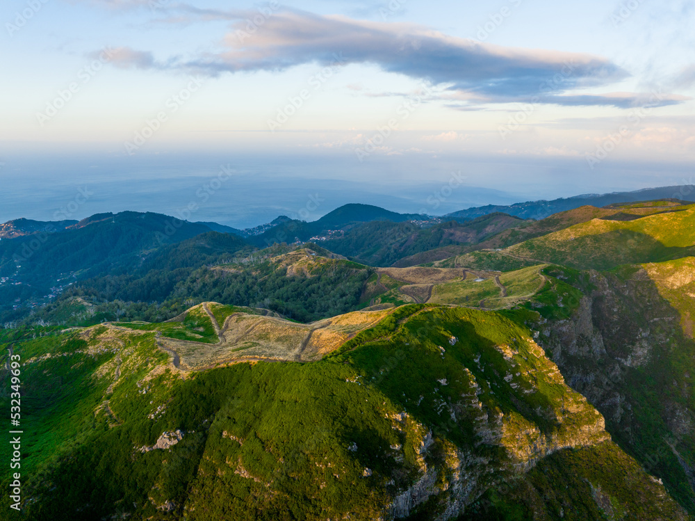 Madeira Island Aerial View. Scenic View During Sunrise. Green Mountains and Cloudy Sky. Portugal. Europe.