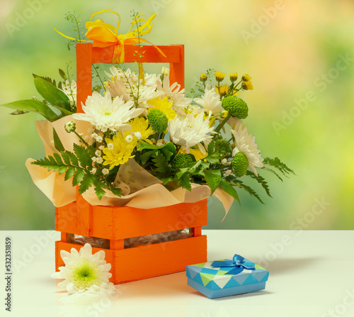 Beautiful bouquet of various flowers with gift boxes.