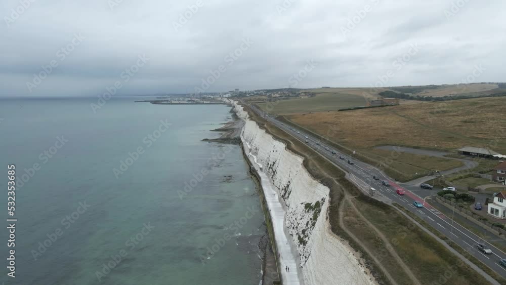 Aerial flight along tall, steep white chalk cliffs of English seashore Aerial flight along tall, steep white chalk cliffs of English seashore