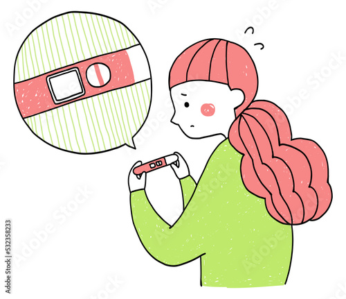 陰性マークが出ている妊娠検査薬を持っている女性