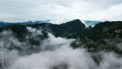 mountain ridge and clouds in rural jungle bush forest. Ban Phahee, Chiang Rai Province, Thailand photo