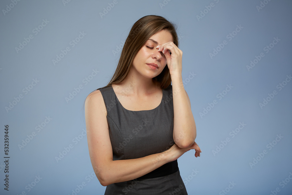 Business woman with headache isolated female portrait with eyes closed on blue. Business woman with headache isolated female portrait with eyes closed on blue.