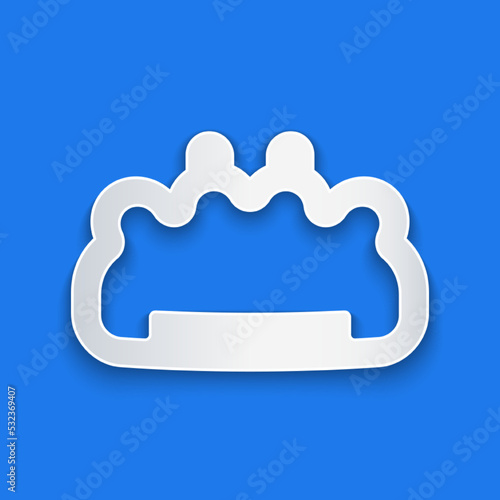 Paper cut Brass knuckles icon isolated on blue background. Paper art style. Vector