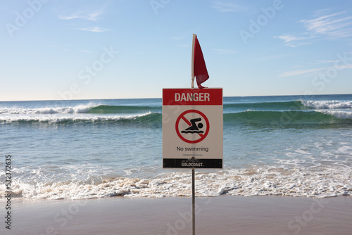 no swimming sign on the beach