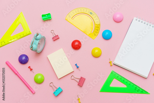 School supplies, stationery on pink background. Pens pencils notepad. Flat lay, top view. Back to school concept