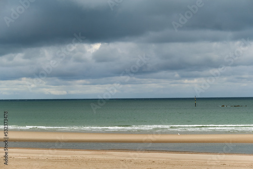low tide and storm clouds at Malo-Les-Bains beach in Dunkirk, france © hectorchristiaen