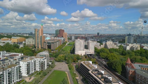 Beautiful aerial view flight panorama curved drone
of Potsdamer Platz on Tilla Durieux Park Berlin Germany at summer day 2022. 4k Marnitz Cinematic from above photo