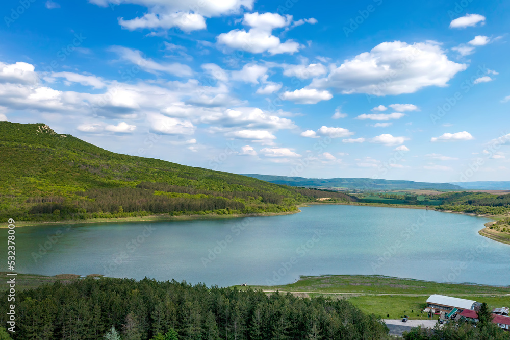 Aerial view from drone of a lake among hills Aerial view from drone of a lake among hills