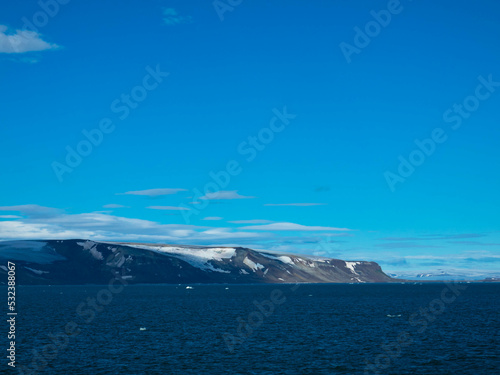 Spectacular panorama view of Wilhelmoya island with mountain range and blue sky. Torellneset, Nordaustlandet   Spitsbergen, Norway. Tourism and vacations concept. © familie-eisenlohr.de