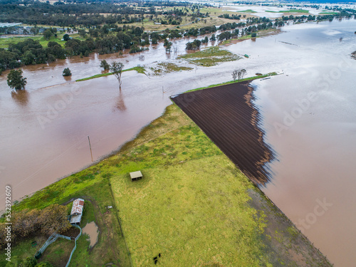 Farm crop paddocks underwater during natural disaster flood photo