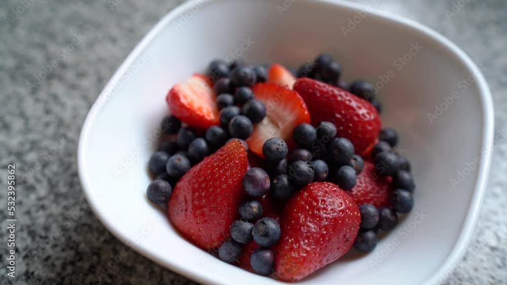 Bowl Of Fresh Blueberries And Strawberries. - close up Bowl Of Fresh Blueberries And Strawberries. - close up