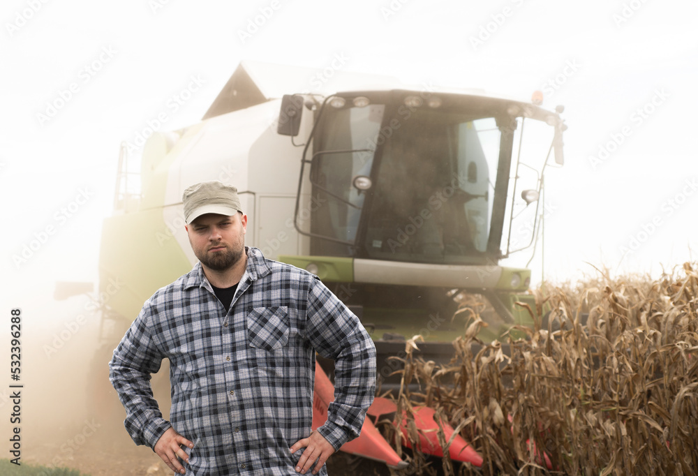 Young farmer examine corn seed in corn fields Young farmer examine corn seed in corn fields