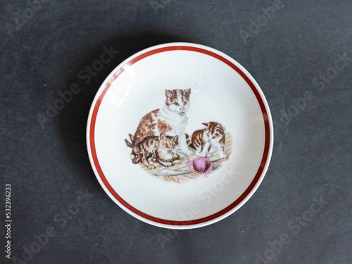 Vintage porcelain plate with cat family pattern