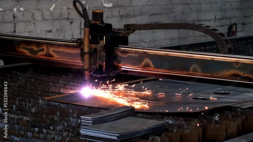 Plasma cutting of metal with a cnc. A plasma cutter cuts a workpiece from a sheet of metal. Laser cutter in production. Industrial metal cutting by plasma laser. 4K video. High definition video Plasma cutting of metal with a cnc. A plasma cutter cuts a workpiece from a sheet of metal. Laser cutter in production. Industrial metal cutting by plasma laser. 4K video. High definition video