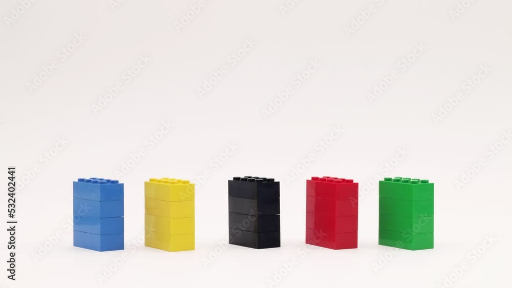 Toy blocks are arranged in colored columns. Stop motion animation. Toy blocks are arranged in colored columns. Stop motion animation.