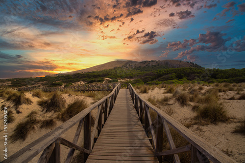 Hiking path over sand dunes in Cala Mesquida, Mallorca, Spain. Selective focus.