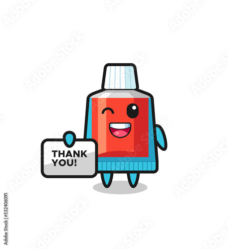 the mascot of the toothpaste holding a banner that says thank you © heriyusuf