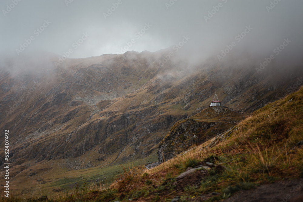 Landscape in Romania, Carpathian Mountains. Foggy morning, rainy, cloudy bad weather. Background, screensaver. Beautiful nature, peace and tourism.