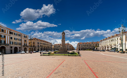 Cuneo, Piedmont, Italy - August 06, 2022: View on Tancredi Duccio Galimberti Square with Statue of Giuseppe Barbaroux, in the background the beginning of corso Nizza photo
