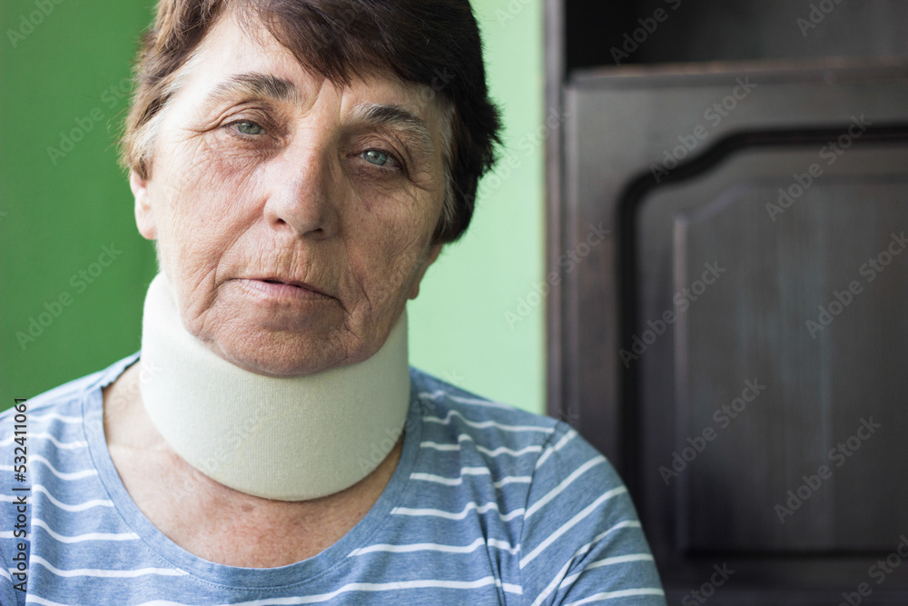 Senior woman with neck injury. Senior woman wearing neck brace