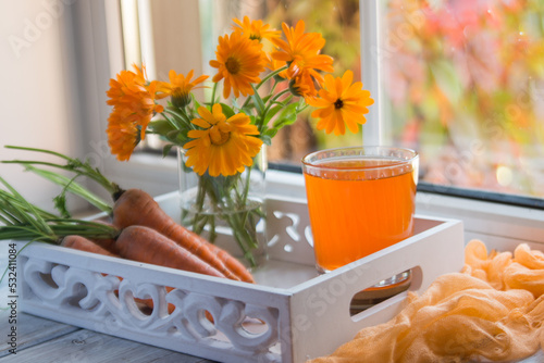 Wallpaper Mural Carrot juice in a glass and fresh carrots on the table.
 Torontodigital.ca