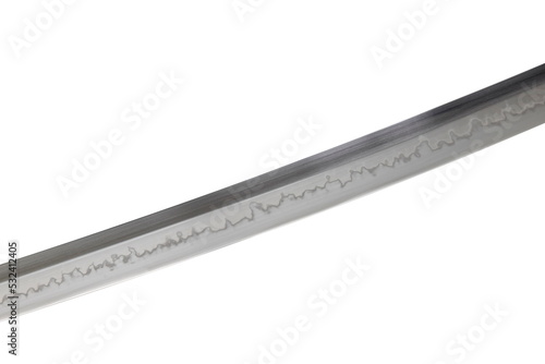 Japanese sword blade on white background. Soft focus.  The wavy pattern on the blade edge is a line of hardness that a blacksmith makes so that the blade doesn't break. Choji Hamon style. photo