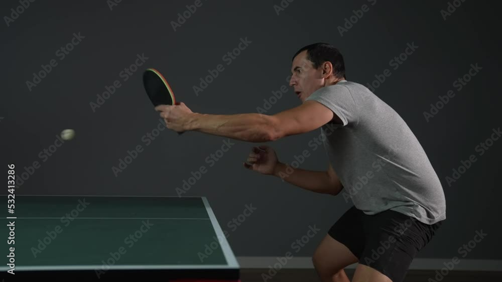 table tennis. man a athlete playing ping pong. sport party tournament concept. sportsman man training playing table lifestyle tennis. forehand and backhand exercise in ping pong table tennis. man a athlete playing ping pong. sport party tournament concept. sportsman man training playing table lifestyle tennis. forehand and backhand exercise in ping pong