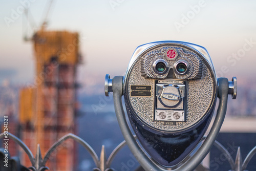 Coin operated binoculars looking out on New York City skyline