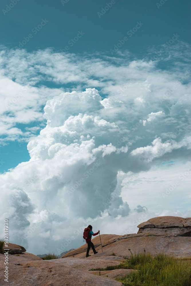 Rear View Of Man Standing On Field Against Sky - obrazy, fototapety, plakaty 