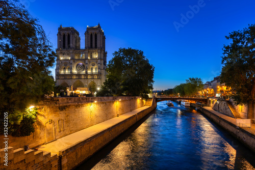 Notre Dame Cathedral in Paris by the Seine River at dawn, France