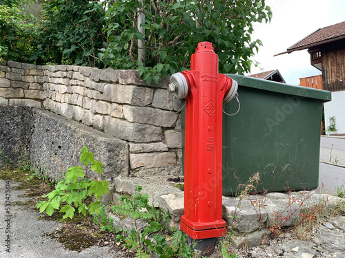 Red fire hydrant on the streets of the German city of Miesbach photo