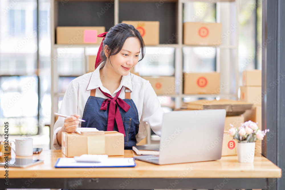 SME entrepreneur Small business entrepreneurs Online selling ideas,Happy Young Asian business owner work on computer and a boxs at home,delivery SME procurement package box deliver to customers, SME entrepreneur Small business entrepreneurs Online selling ideas,Happy Young Asian business owner work on computer and a boxs at home,delivery SME procurement package box deliver to customers,