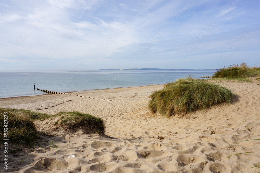 scenic view over sand dunes at empty beach in south of England. sea view from sandy beach scenic view over sand dunes at empty beach in south of England. sea view from sandy beach