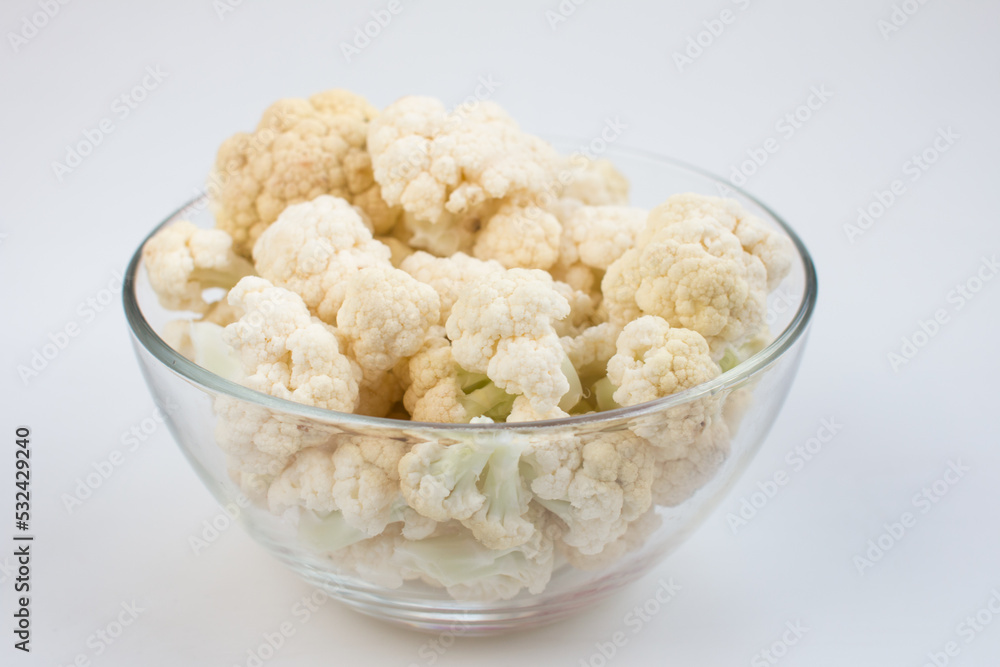fresh cauliflower on a white background. A useful fortified vegetable for weight loss fresh cauliflower on a white background. A useful fortified vegetable for weight loss
