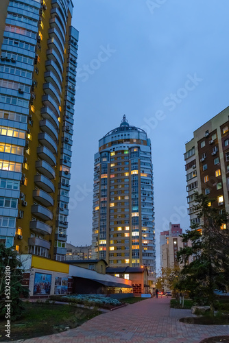 Night view of modern buildings in the Obolon district of Kiev, Ukraine, close to the Dnieper River