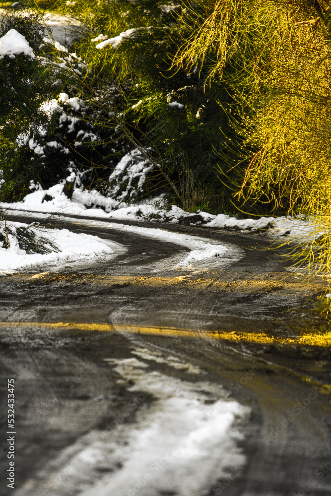 Fototapeta premium mountain road with snow and curves