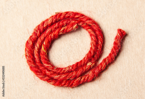 image of red wool thread 