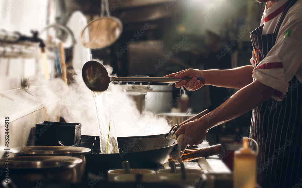 Naklejka premium Chef stir fry cooking