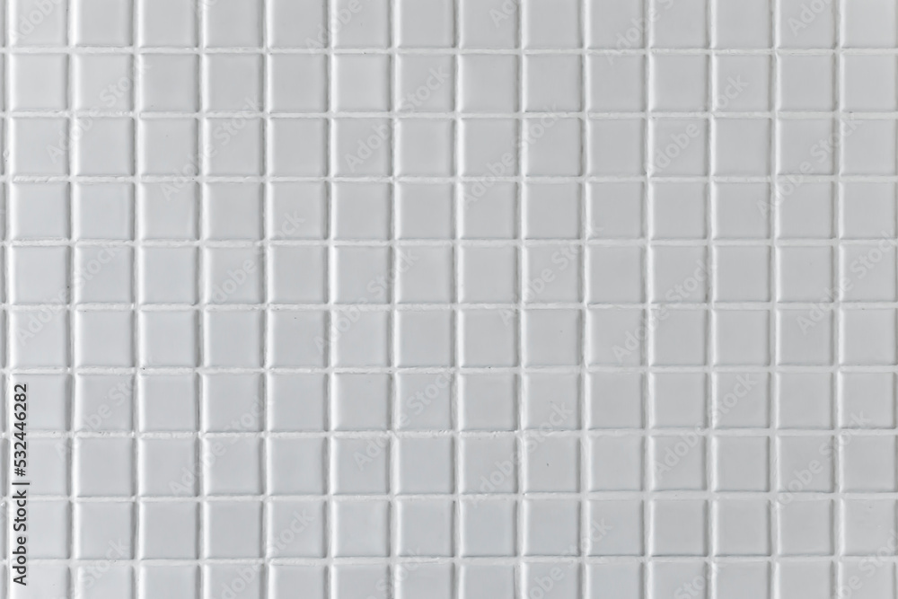 White mosaic background or texture in the bathroom.