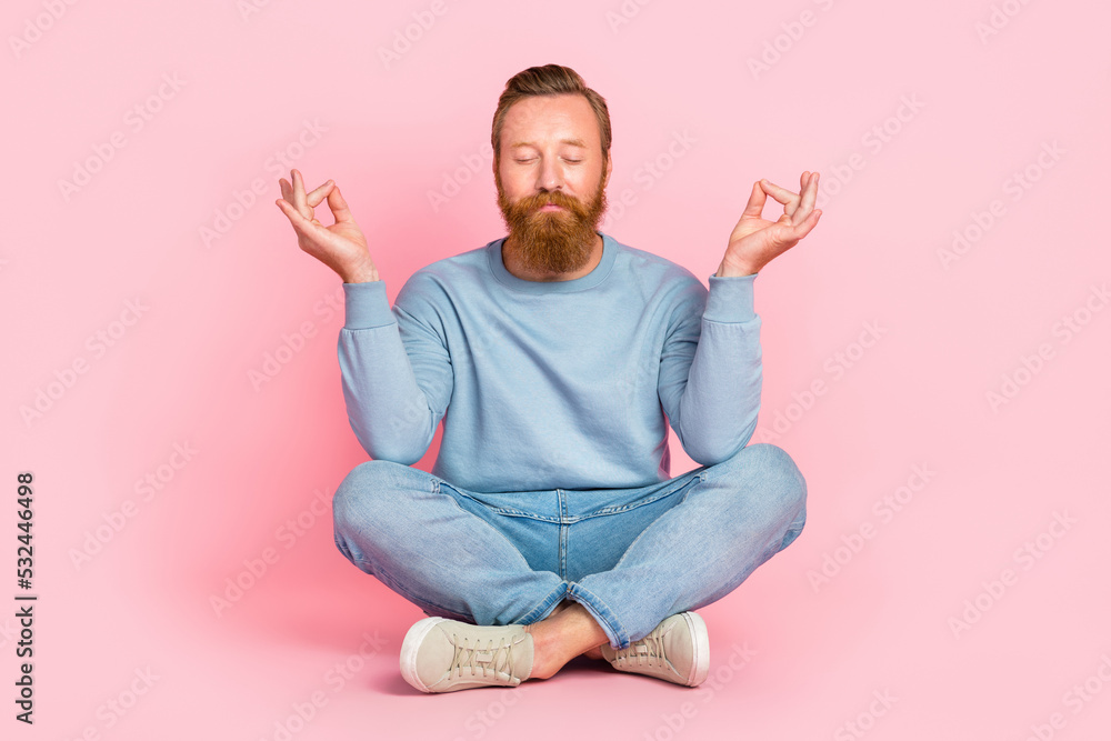 © deagreez - Full body portrait of content young man sitting floor closed eyes crossed legs meditate isolated on pink color background © deagreez - Full body portrait of content young man sitting floor closed eyes crossed legs meditate isolated on pink color background