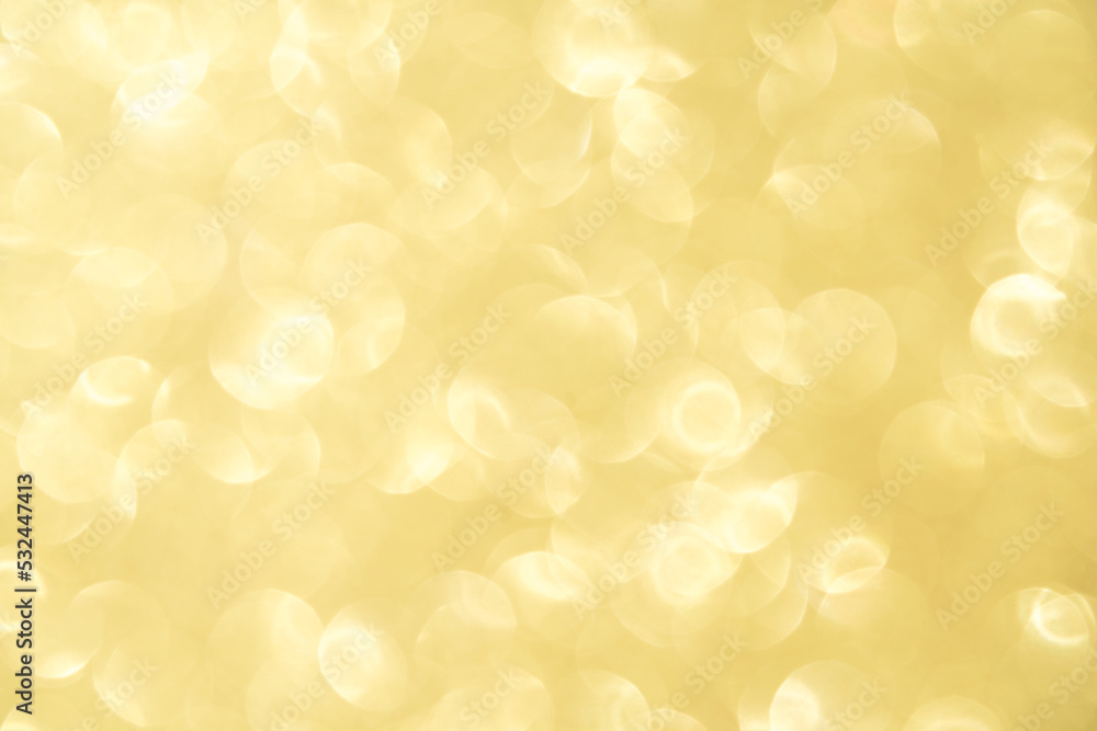 Beautiful golden bokeh background. Abstract festive blurred background for your project with copy space for text. Template for greeting card or banner
