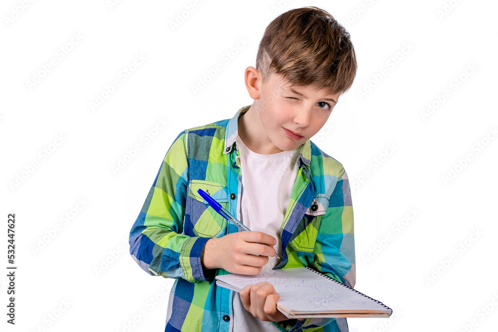 cute boy with a notebook and a pen in his hand.learning.education.school.student cute boy with a notebook and a pen in his hand.learning.education.school.student