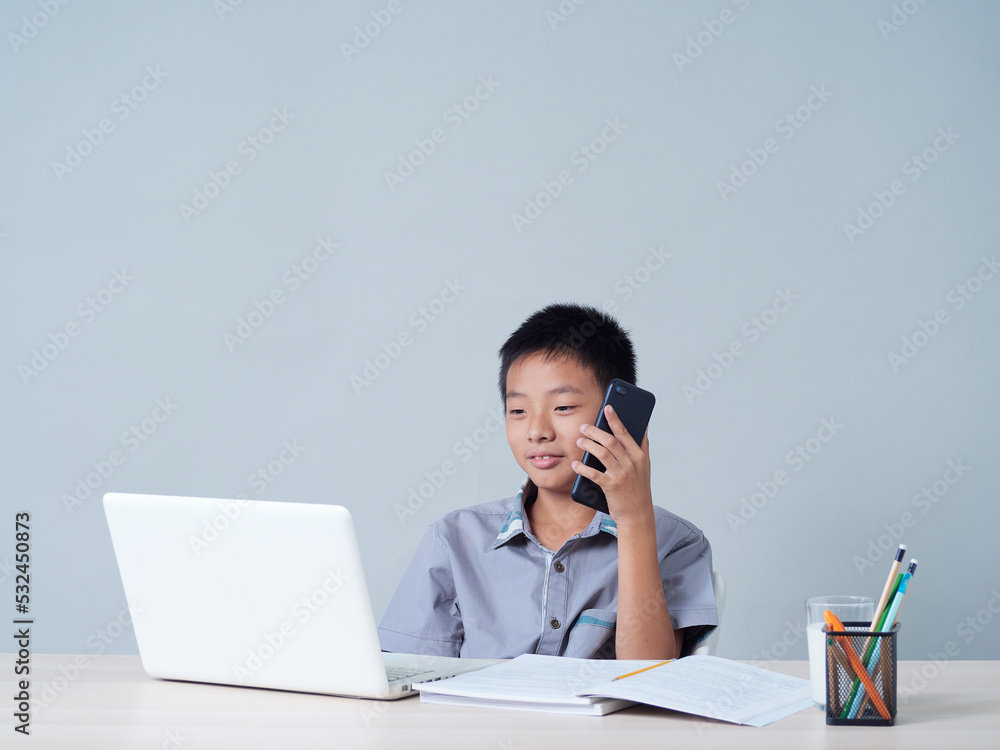 Little boy with laptop studying online. Little boy with laptop studying online.
