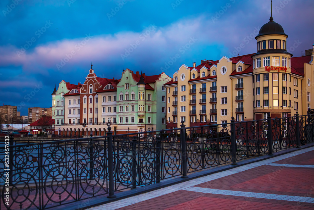 Colored houses on the central embankment in the evening in Kaliningrad.