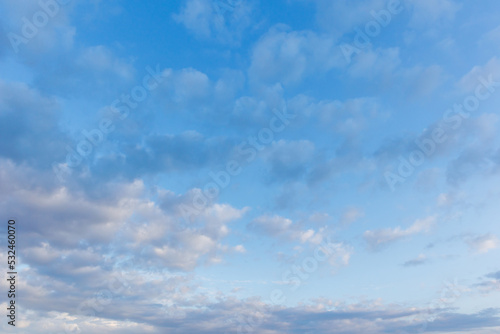 White fluffy clouds in the blue sky. Blue sky background and white clouds soft focus, pastel sky © Chmutphoto