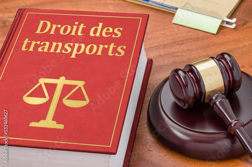 A law book with a gavel - Transport law in french - Droit des transports