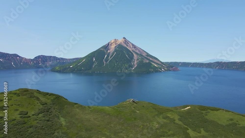 AERIAL Helicopter standing on the edge of Krenitsyn volcano. Onecotan island photo