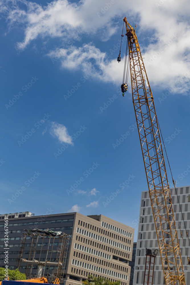 Fototapeta premium Blue sky with scattered clouds above a corporate house